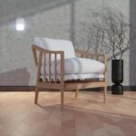 A wooden armchair with white cushions in a room.