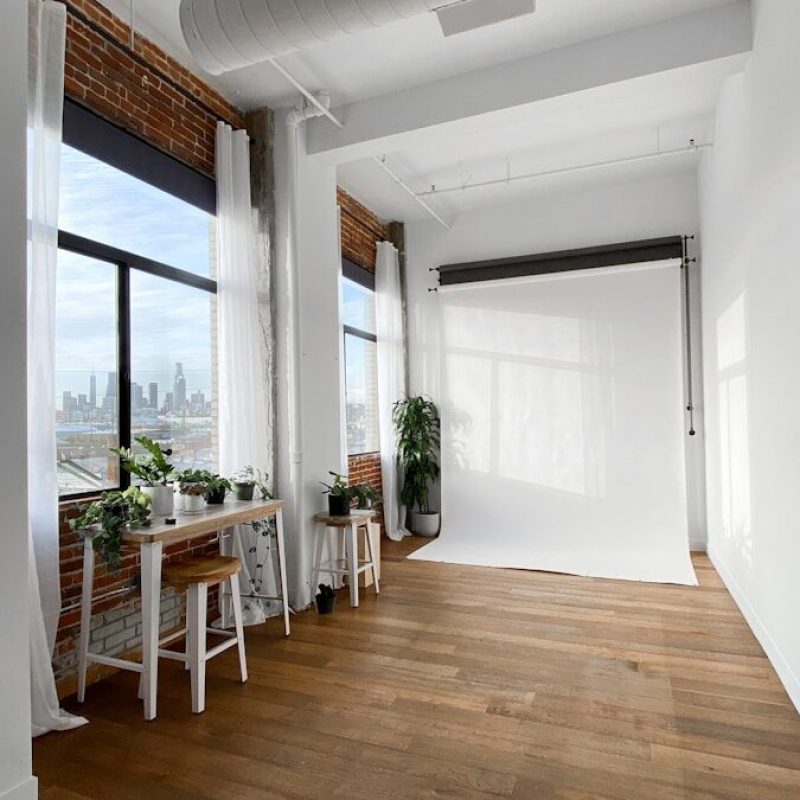 brown wooden table near window